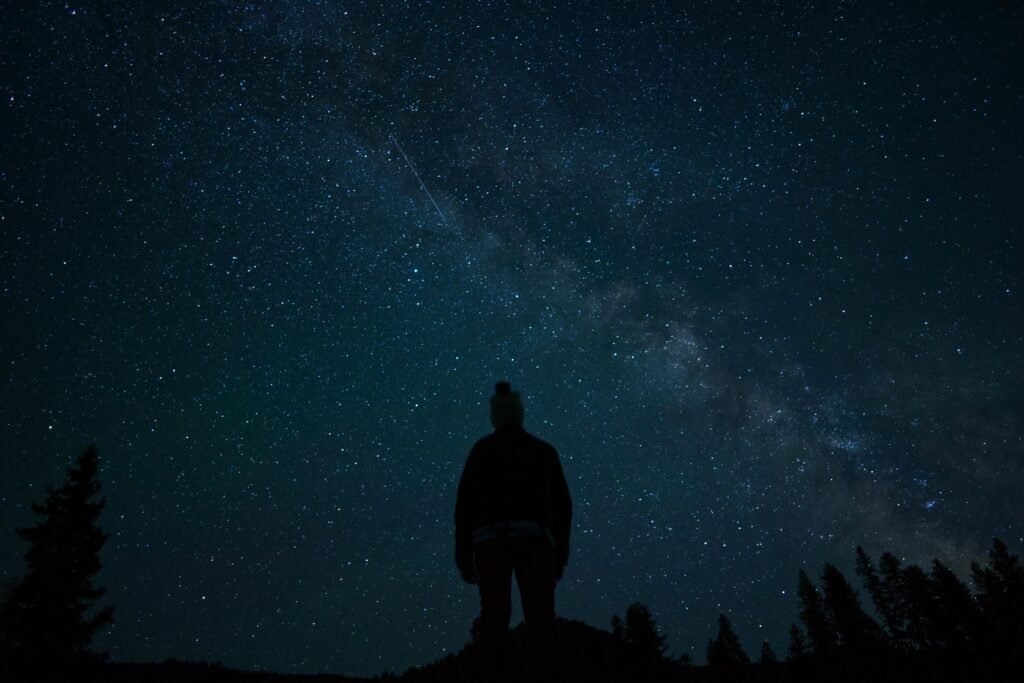 pexels-photo-26151143-26151143 A captivating silhouette of a person stargazing under the Milky Way in Naples, Idaho.